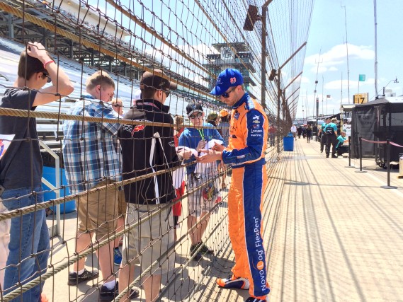 Signing autographs after qualifying.